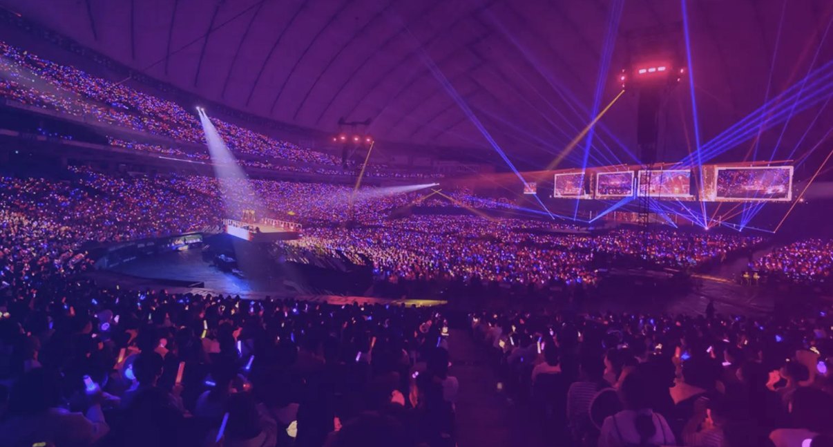 Stadium audience under stage lighting
